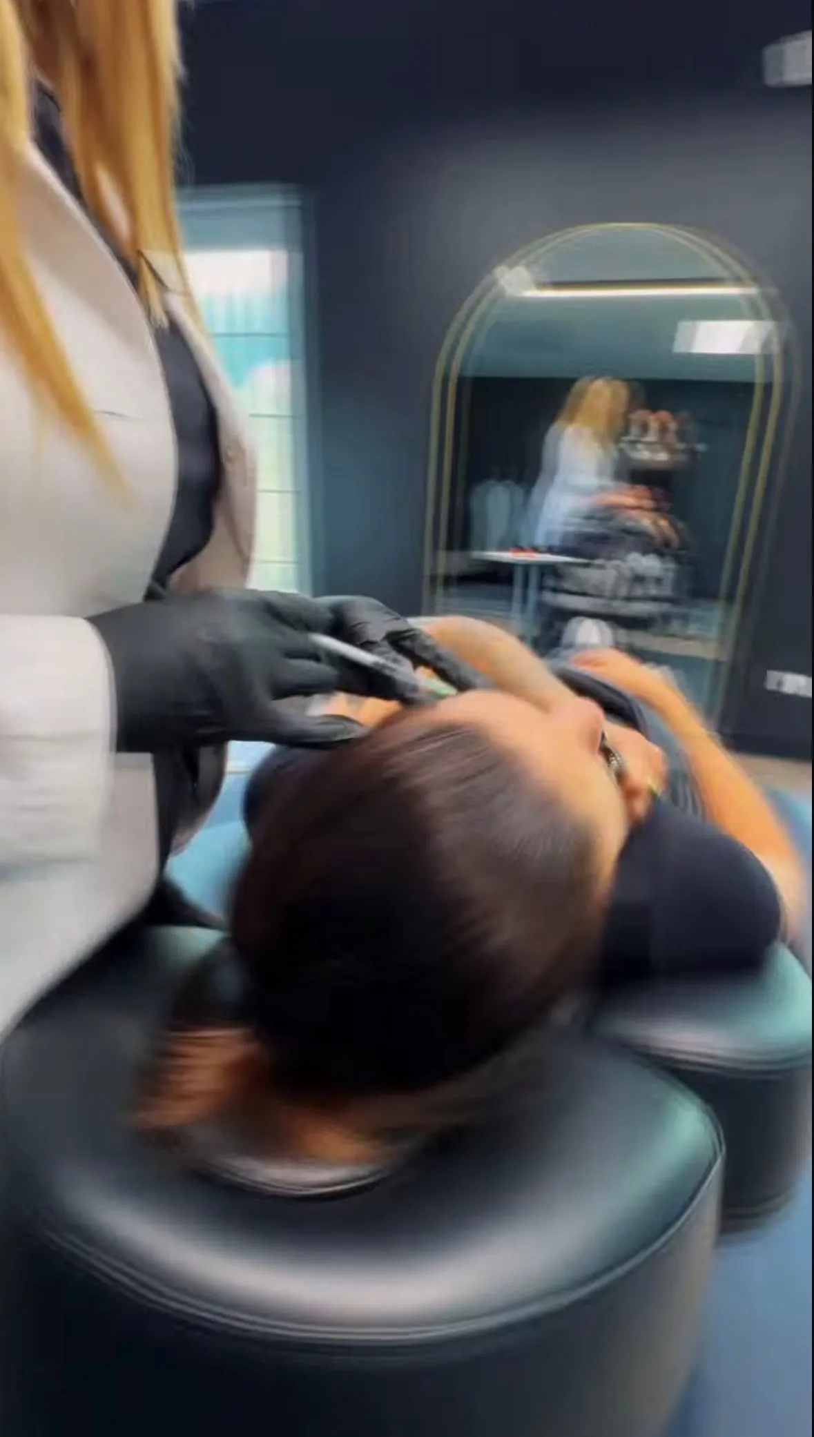 A trained injector performing an aesthetic injectable treatment at Defiant Health in Lisle, IL